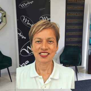 Anita, holistic wellness specialist at Merluza Hair & Beauty in Hall Green, Birmingham – offering expert acupuncture and sound therapy for balance and relaxation.